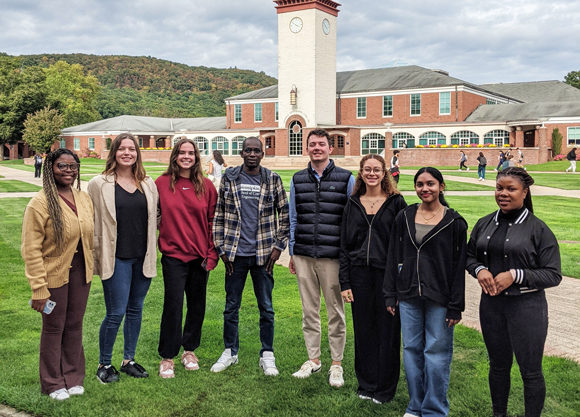 Members of the International Student Advisory Board pose for a photo on the quad